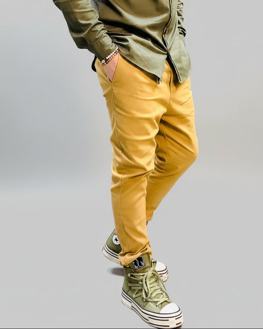 model wearing yellow pants in a dynamic position 
