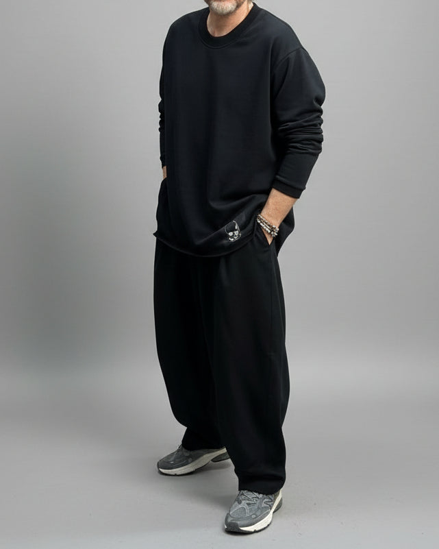 Model standing against beige backdrop in a dynamic position 