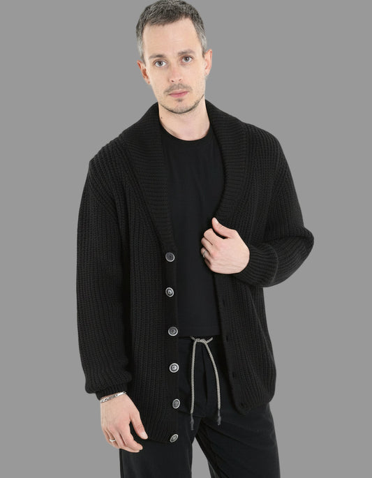 Man wearing a black cardigan with a white background, 