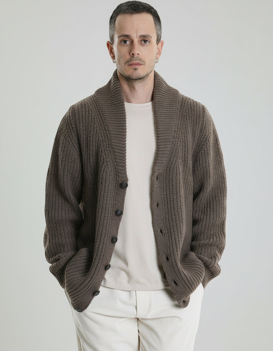 Man wearing a brown cardigan over a white shirt 